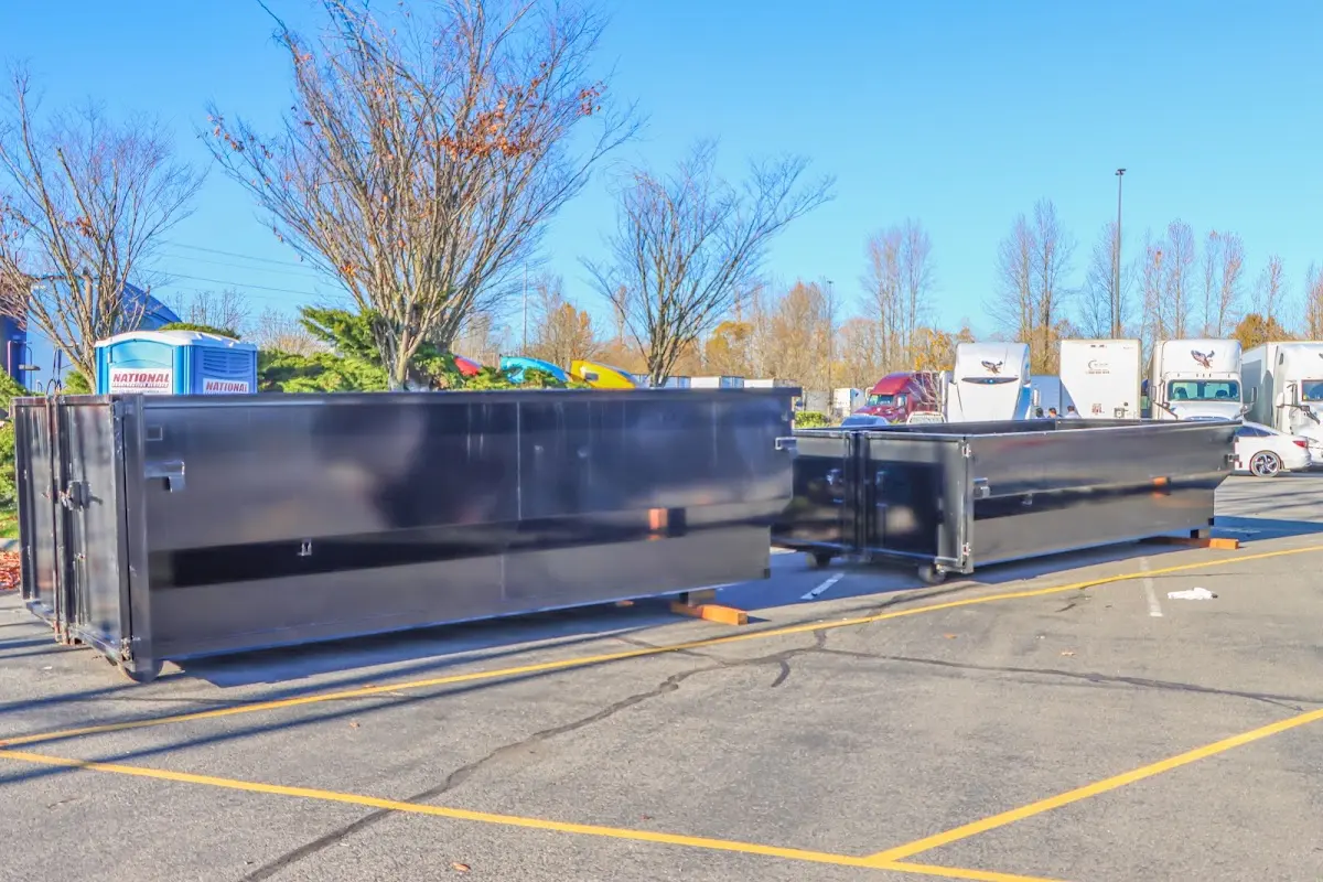 Professional dumpster rental service with roll-off container on residential driveway in Circleville